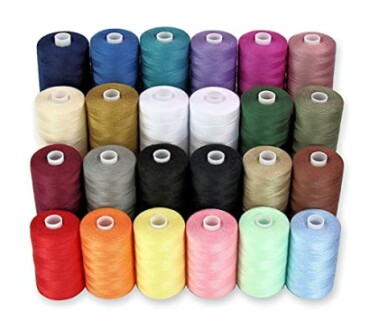 Assorted colorful sewing thread spools arranged in rows.